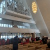 Inside the Arctic Cathedral, facing the silver organ suspended high above the entrance. Also visible is some of the truly enormous crowd of tourists who had been bussed in.